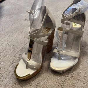 Dolce Vita off white wedges with gold accent.